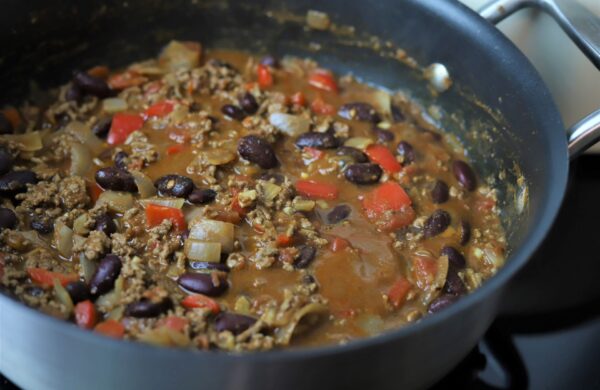 Seasoned Pioneers chilli con carne in a metal sauce pan